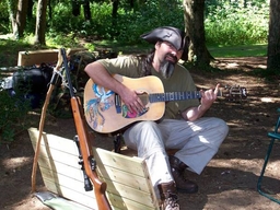 Guitar....rifle....hammock.....average camping trip says I...