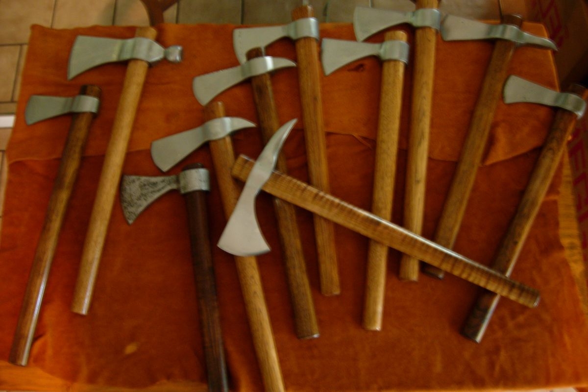 assorted tomahawks and axes